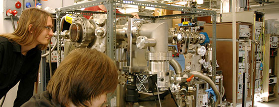 students looking at a large metal machine